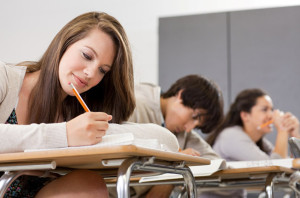 High school students sitting in classroom --- Image by © Image Source/Corbis